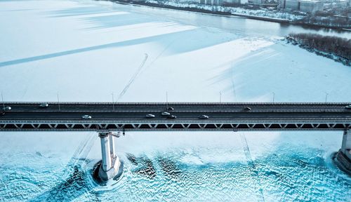 Aerial view of bridge over frozen river