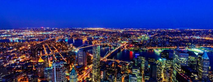 High angle view of illuminated city buildings at night