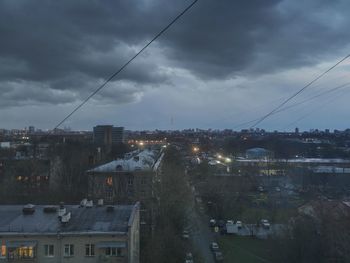 High angle view of illuminated buildings in city against sky