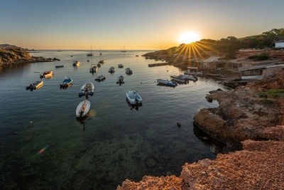 Coastline bay with boats in sunrise, ibiza