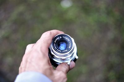 Close-up of man photographing
