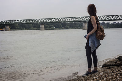 Rear view of women walking on beach