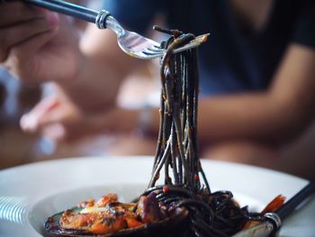 Close-up of person preparing food