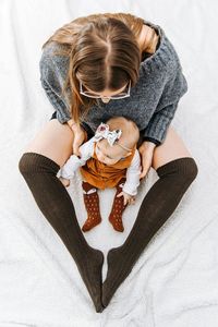 High angle view of mother with baby girl