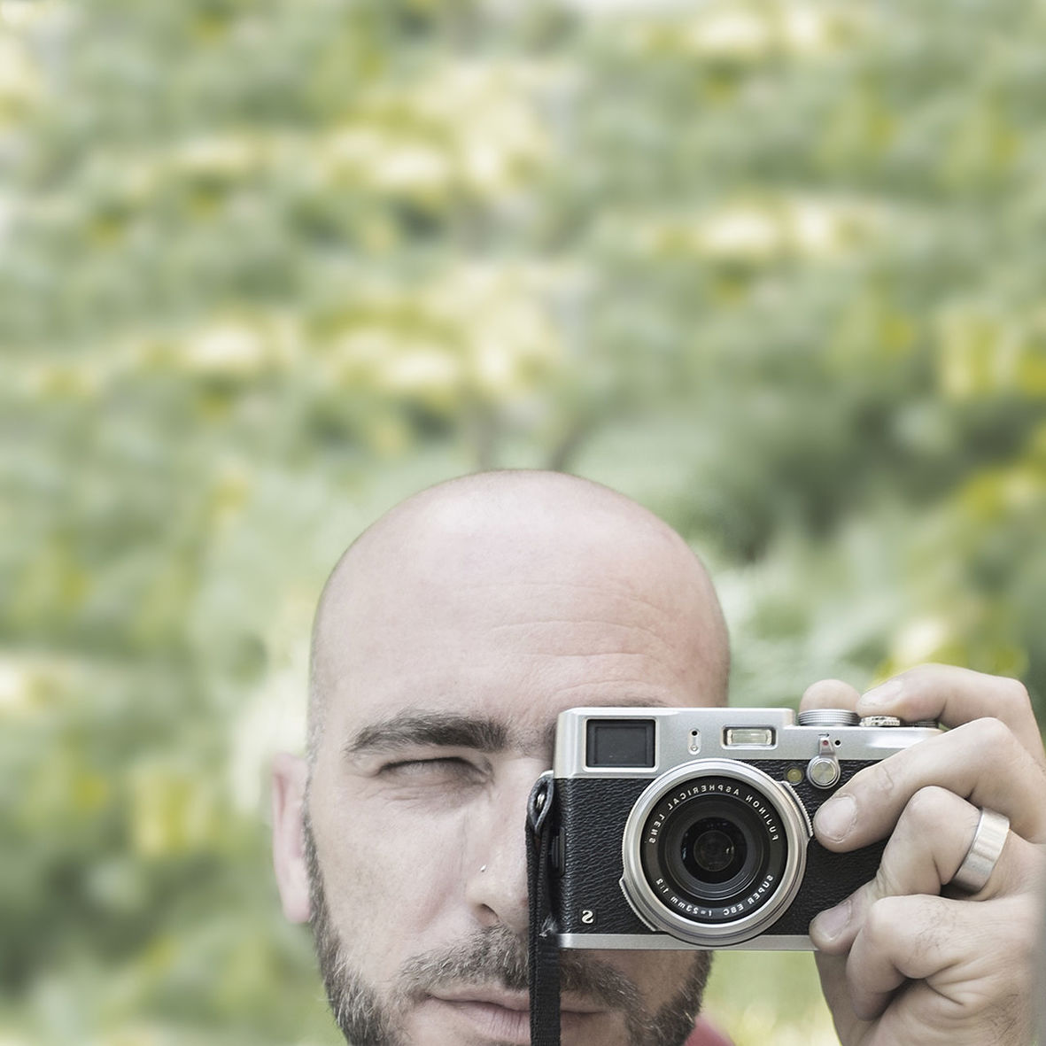 person, holding, photography themes, lifestyles, focus on foreground, close-up, part of, leisure activity, headshot, photographing, technology, cropped, men, camera - photographic equipment, communication, digital camera, human finger