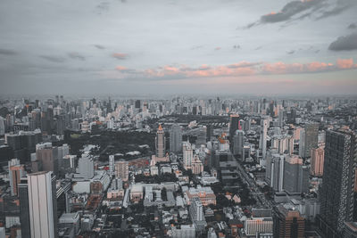 Aerial view of modern buildings in city against sky