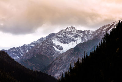 Low angle view of mountains against sky during sunset