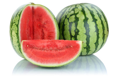 Close-up of red fruit against white background