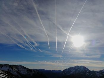 Low angle view of vapor trails in sky