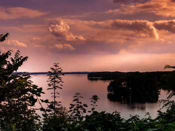 Scenic view of lake against sky during sunset