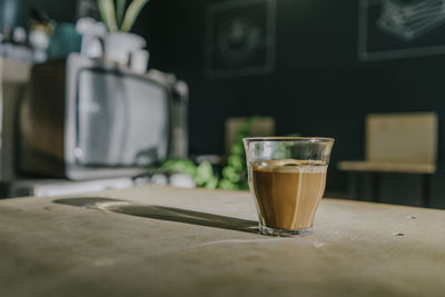 Close-up of coffee in glass on table