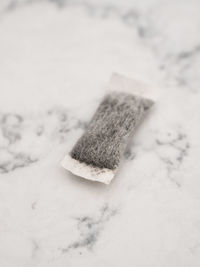 High angle view of snow on floor against white background