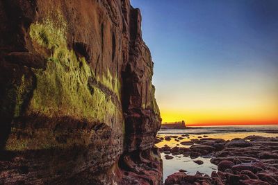 Scenic view of sea against clear sky during sunset