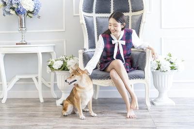Portrait of young woman with dog