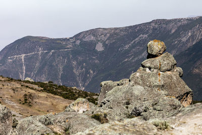 Rocks on mountain against sky