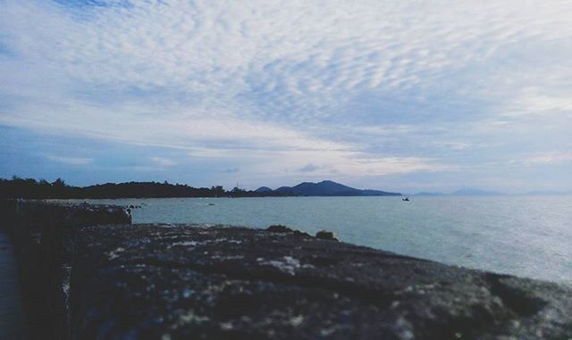 water, sea, sky, tranquil scene, tranquility, scenics, horizon over water, beauty in nature, cloud - sky, beach, nature, shore, rock - object, cloud, idyllic, calm, cloudy, outdoors, non-urban scene, remote