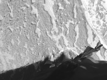 Low section of man on sand