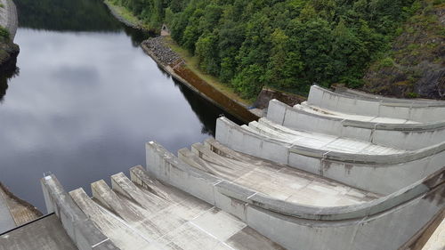 High angle view of dam by lake