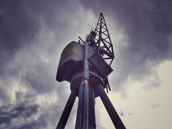 Low angle view of windmill against sky