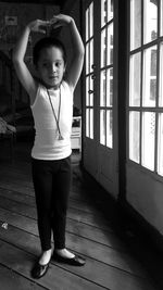 Boy practicing ballet dance at home