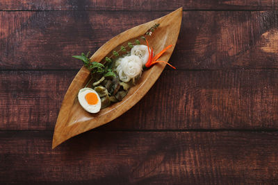High angle view of fish on cutting board