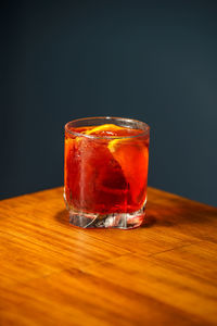 Close-up of drink on table against black background