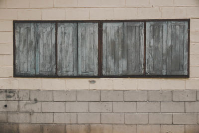 Closed window on wall of building