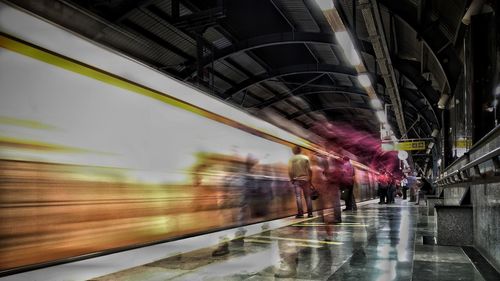 Blurred motion of train at railroad station