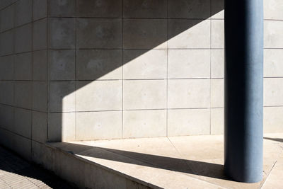 Abstract composition with gray wall and a column