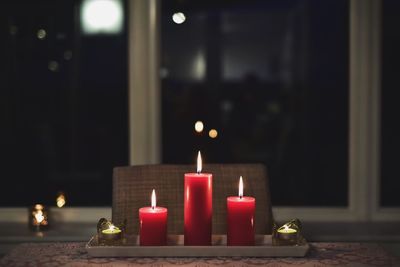 Close-up of tea light candles on table