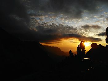 Silhouette mountains against sky during sunset