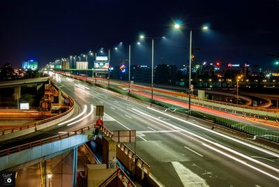 High angle view of light trails on road at night