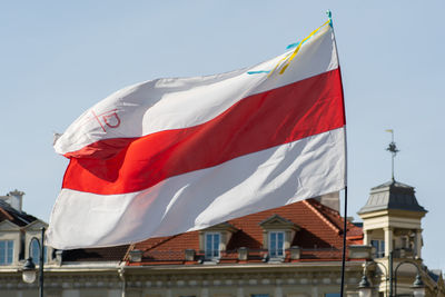 Low angle view of flag against sky