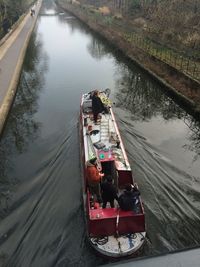 High angle view of people on boat sailing in river