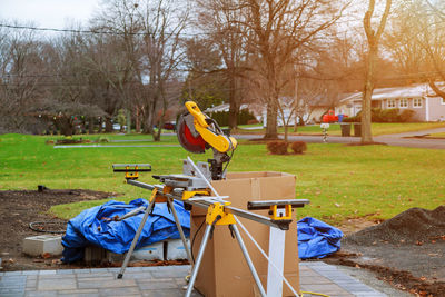 Power tools on footpath at park