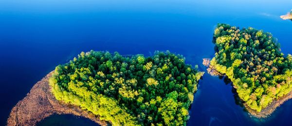 Panoramic view of sea against blue sky