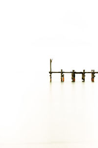 Close-up of piano against white background