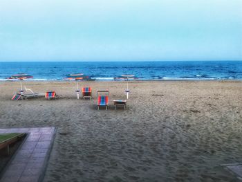 Scenic view of beach against clear sky