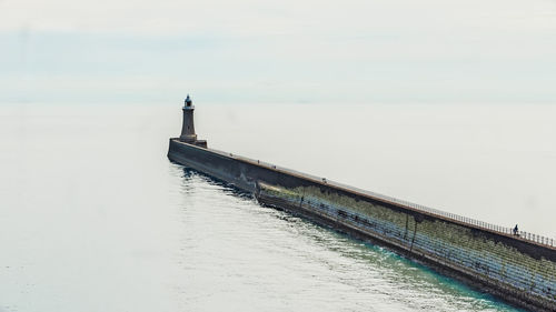 Pier over sea against sky