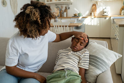 High angle view of mother and daughter at home