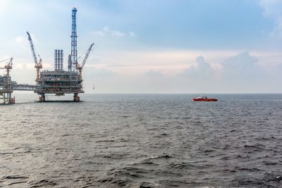 A fast crew boat approaching an oil platform for a crew change at offshore terengganu oil field