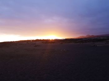 Scenic view of landscape against sky during sunset