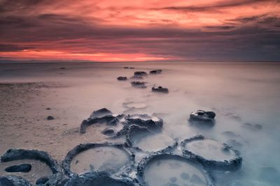 Scenic view of sea against sky during sunset