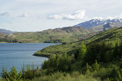 Scenic view of mountains against cloudy sky