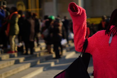 Close-up of person holding umbrella during winter