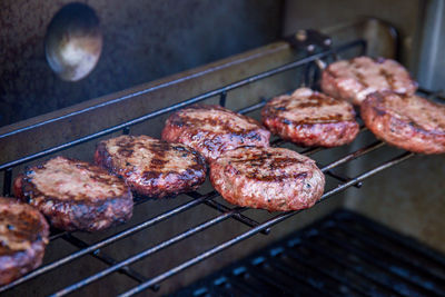 High angle view of meat on barbecue grill