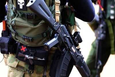 Rear view of army soldiers standing outdoors