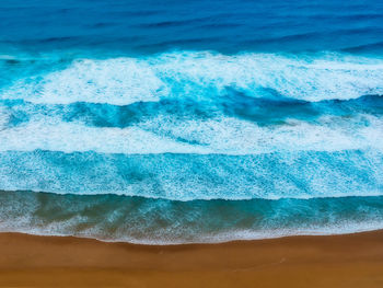 High angle view of surf on beach