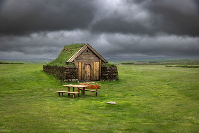House on field against sky