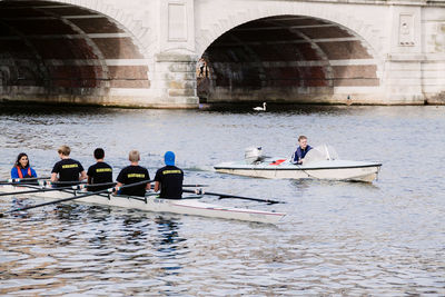 People on boat in river